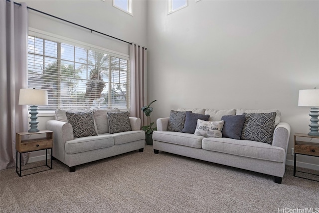 carpeted living room with plenty of natural light