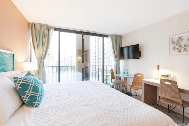 bedroom featuring access to outside and floor to ceiling windows