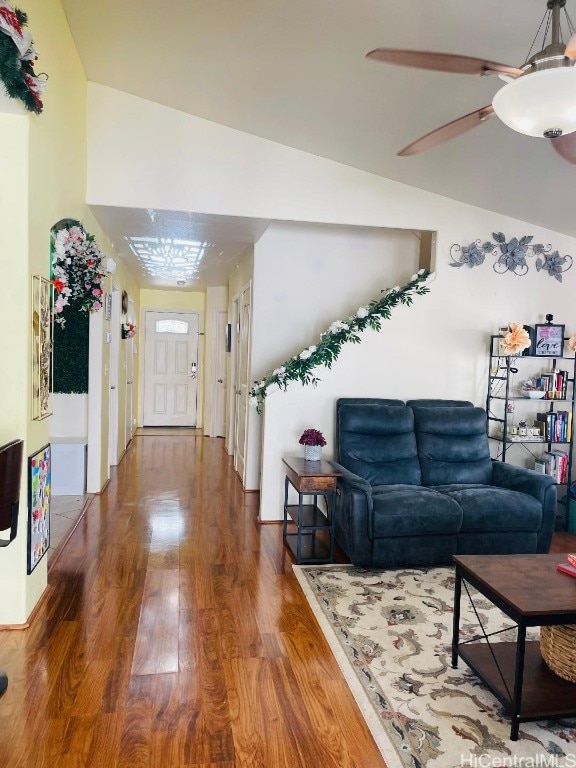 living room with lofted ceiling and wood-type flooring