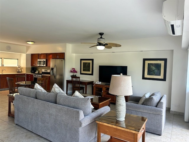 living room with light tile patterned floors and ceiling fan