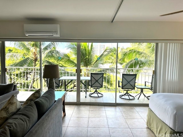 bedroom featuring light tile patterned floors, a wall mounted AC, and access to exterior