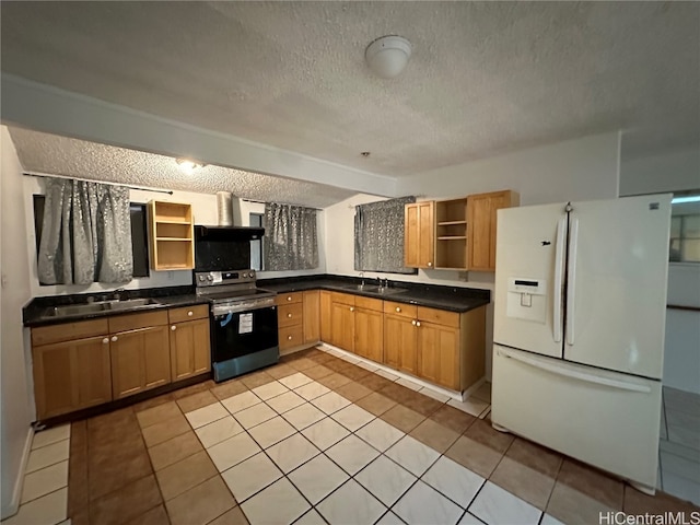 kitchen with white refrigerator, a textured ceiling, sink, light tile patterned floors, and electric range