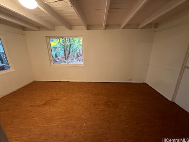 spare room featuring beam ceiling