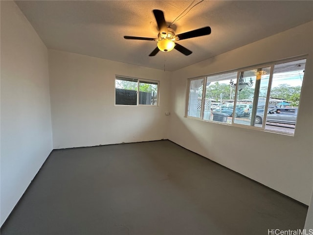 unfurnished room featuring a textured ceiling and ceiling fan