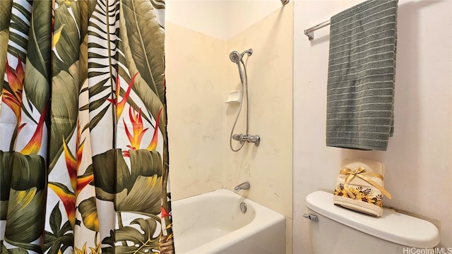 bathroom with shower / tub combo with curtain and toilet