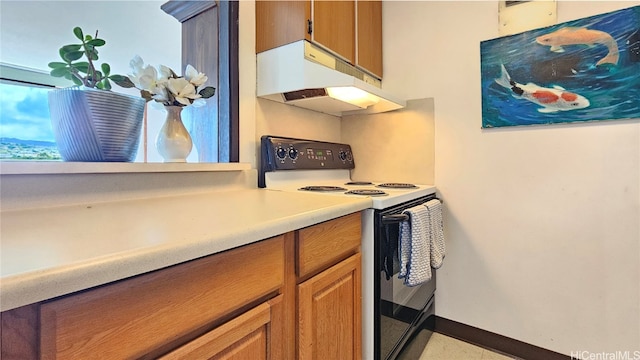 kitchen featuring black range with electric stovetop