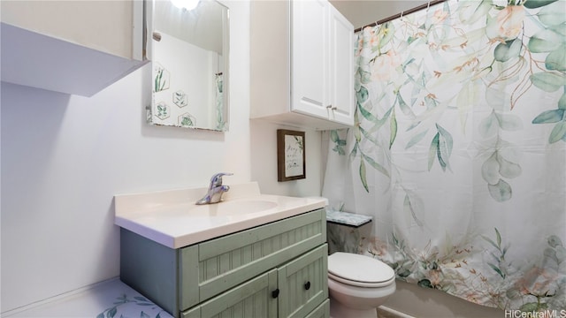 bathroom featuring vanity and toilet