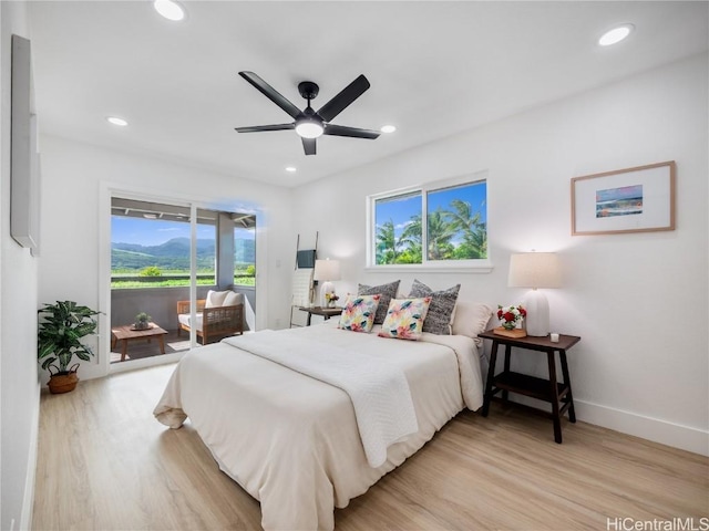 bedroom featuring light wood-type flooring, access to outside, and ceiling fan