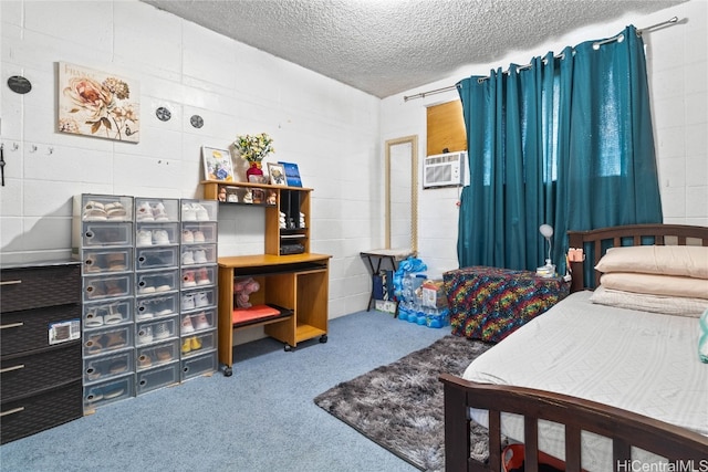 carpeted bedroom with cooling unit and a textured ceiling