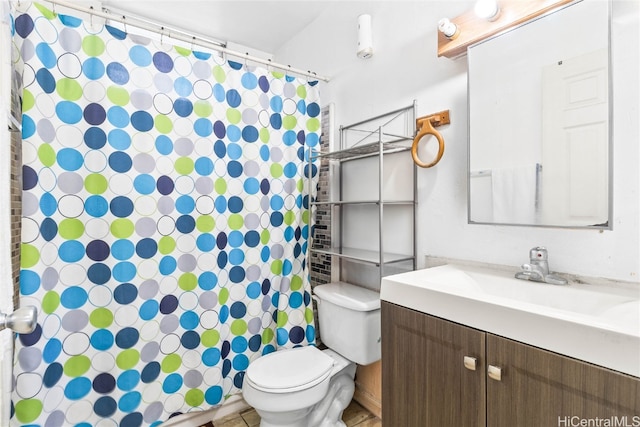 bathroom featuring toilet, a shower with curtain, and vanity