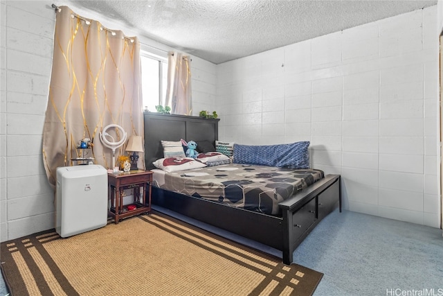 carpeted bedroom with a textured ceiling