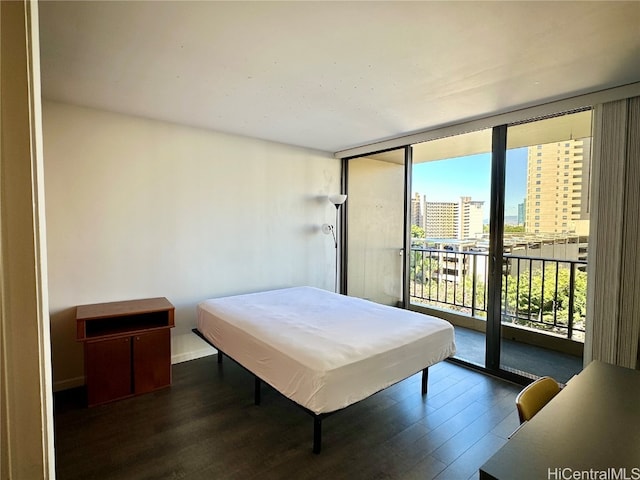 bedroom with access to exterior, a wall of windows, dark hardwood / wood-style floors, and pool table