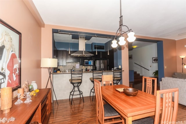 dining area featuring dark hardwood / wood-style floors