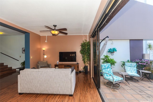 1088 Bishop St Unit 1125, Honolulu, HI 96813 - living area featuring wood finished floors, a ceiling fan, and stairs