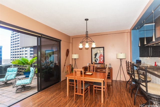 dining room with a chandelier and hardwood / wood-style floors