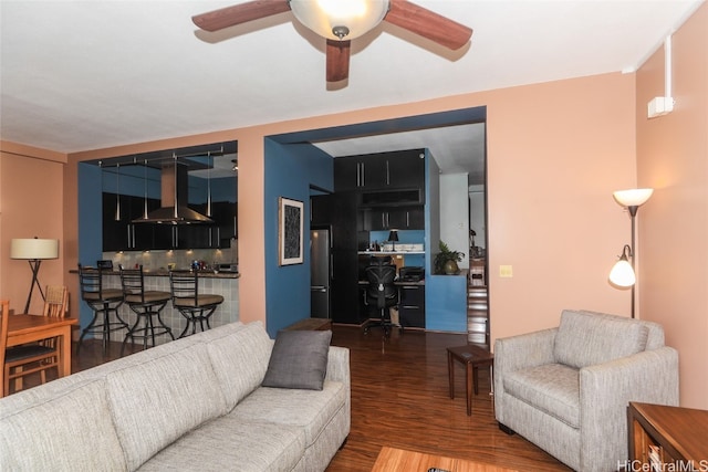 living room with dark hardwood / wood-style floors and ceiling fan