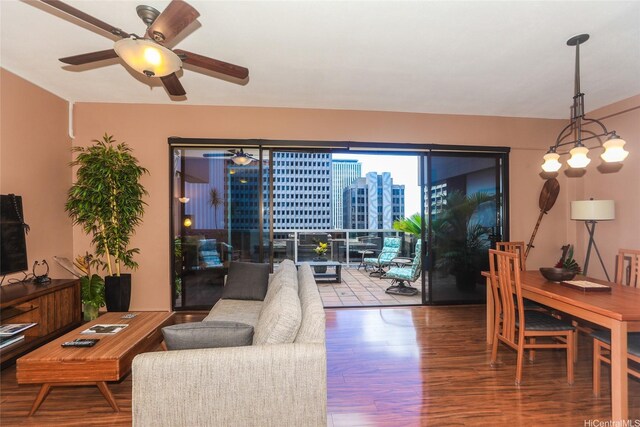 1088 Bishop St Unit 1125, Honolulu, HI 96813 - living room featuring wood finished floors, ceiling fan, and a view of city