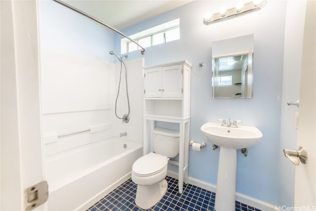 bathroom featuring shower / washtub combination and toilet