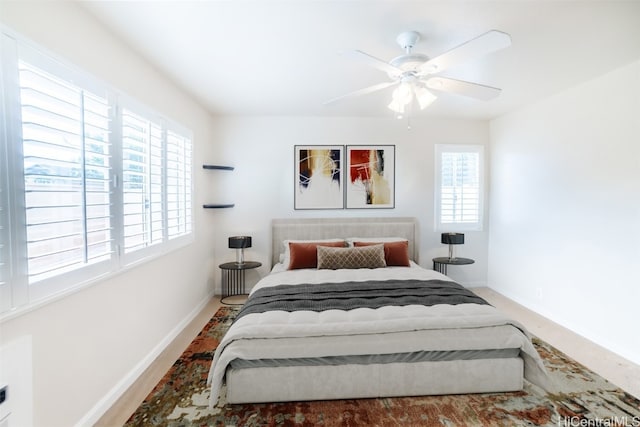 bedroom featuring hardwood / wood-style floors and ceiling fan