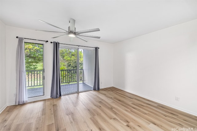 unfurnished room with ceiling fan and light hardwood / wood-style floors