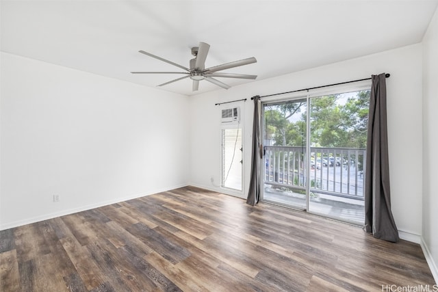 spare room with ceiling fan, a healthy amount of sunlight, and dark hardwood / wood-style flooring