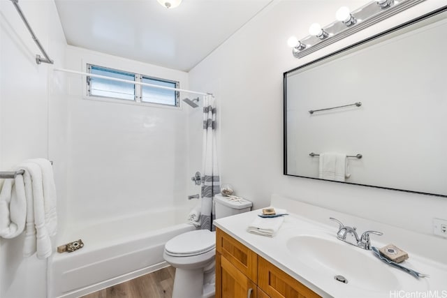 full bathroom featuring toilet, vanity, wood-type flooring, and shower / bath combo with shower curtain