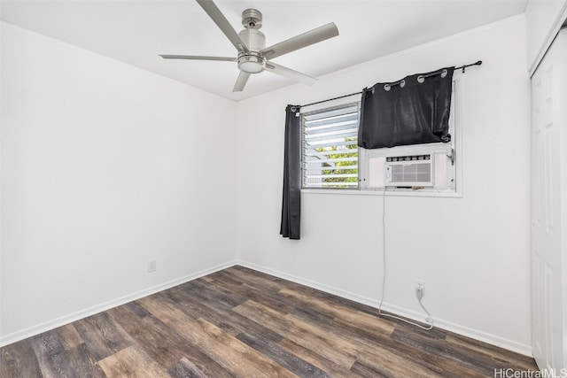 empty room with dark wood-type flooring, cooling unit, and ceiling fan