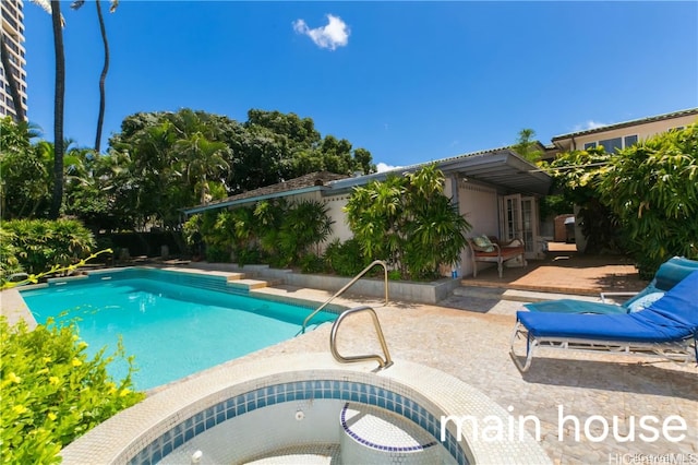 view of swimming pool featuring a patio area