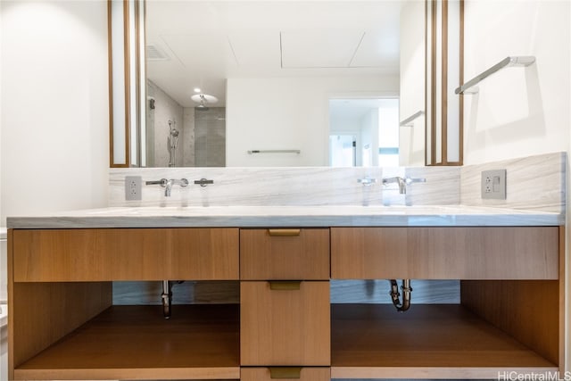 bathroom with vanity and walk in shower