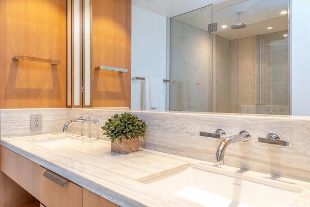 bathroom featuring vanity and backsplash