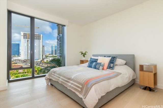 bedroom with hardwood / wood-style flooring