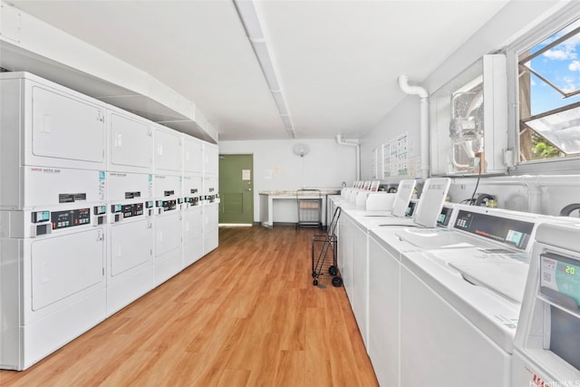 98-1038 Moanalua Rd Unit 1102, Aiea, HI 96701 - shared laundry room with estacked washer and dryer, light wood-type flooring, and independent washer and dryer