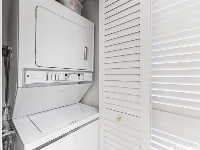 laundry area with stacked washer / drying machine