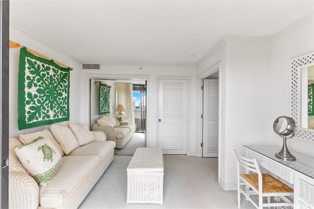 carpeted living room with ornamental molding