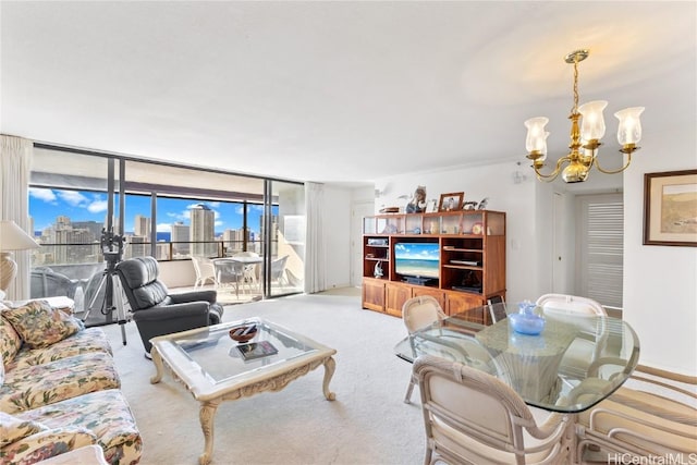 carpeted living room with an inviting chandelier and a wall of windows