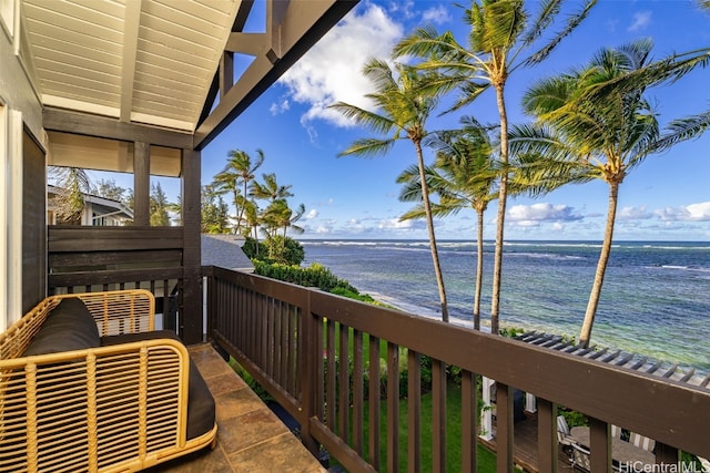 balcony featuring a water view