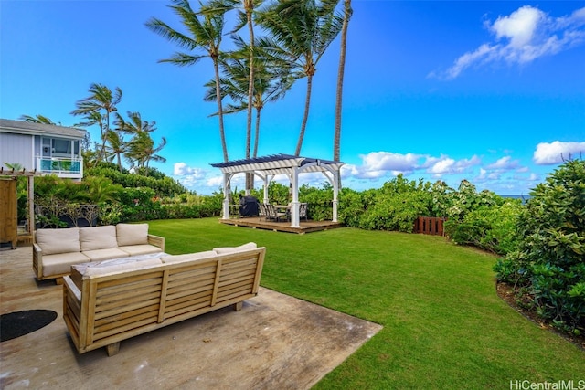 view of yard featuring a pergola, a wooden deck, a patio, and an outdoor hangout area