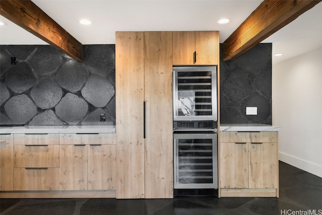 bar featuring beam ceiling, stainless steel double oven, and beverage cooler