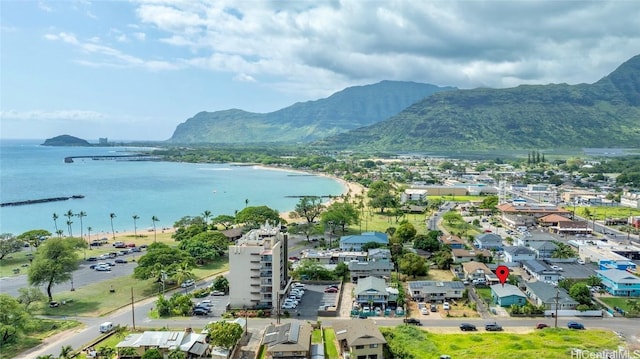 bird's eye view with a water and mountain view