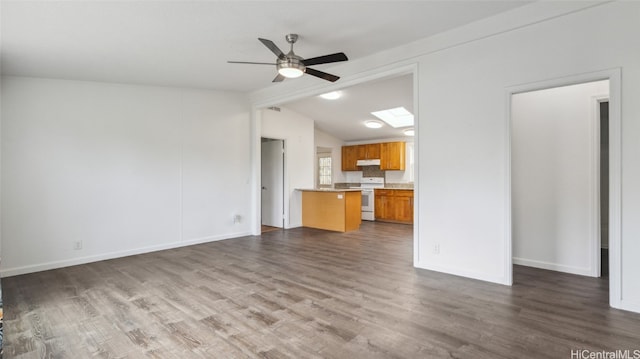 unfurnished living room featuring lofted ceiling with beams, ceiling fan, and dark hardwood / wood-style flooring