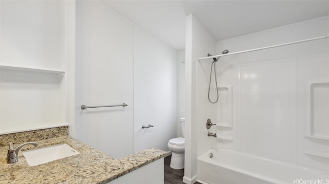 full bathroom with vanity, hardwood / wood-style flooring, toilet, and shower / washtub combination