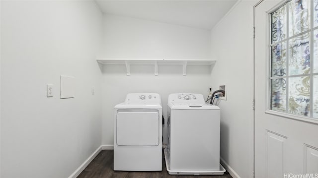 clothes washing area with dark hardwood / wood-style floors, a healthy amount of sunlight, and independent washer and dryer