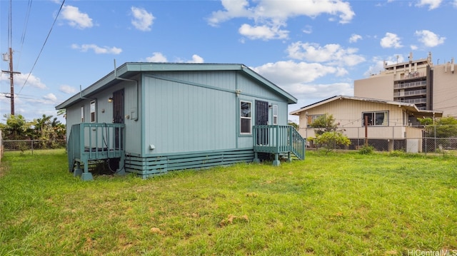 back of house with a yard