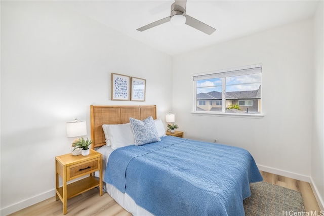 bedroom featuring light hardwood / wood-style flooring and ceiling fan