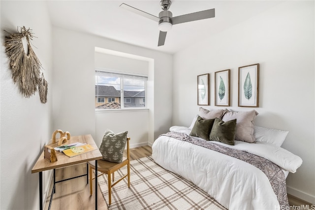 bedroom featuring ceiling fan and light hardwood / wood-style floors