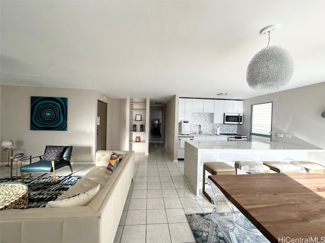 tiled living room featuring sink