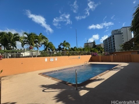 view of swimming pool featuring a patio