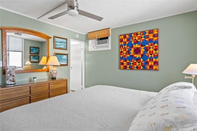 bedroom featuring a wall mounted AC, ceiling fan, and a textured ceiling