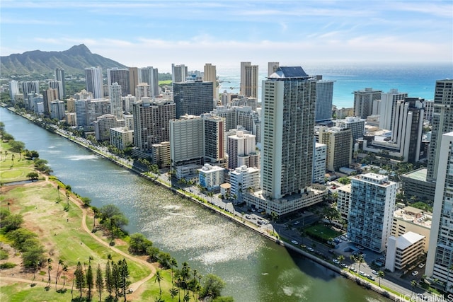 property's view of city featuring a water and mountain view