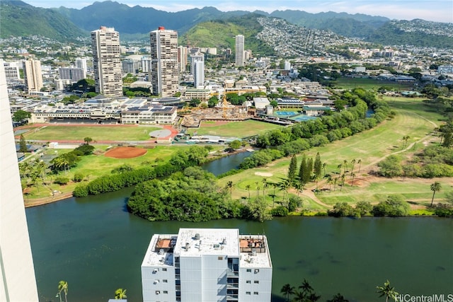 birds eye view of property with a water and mountain view